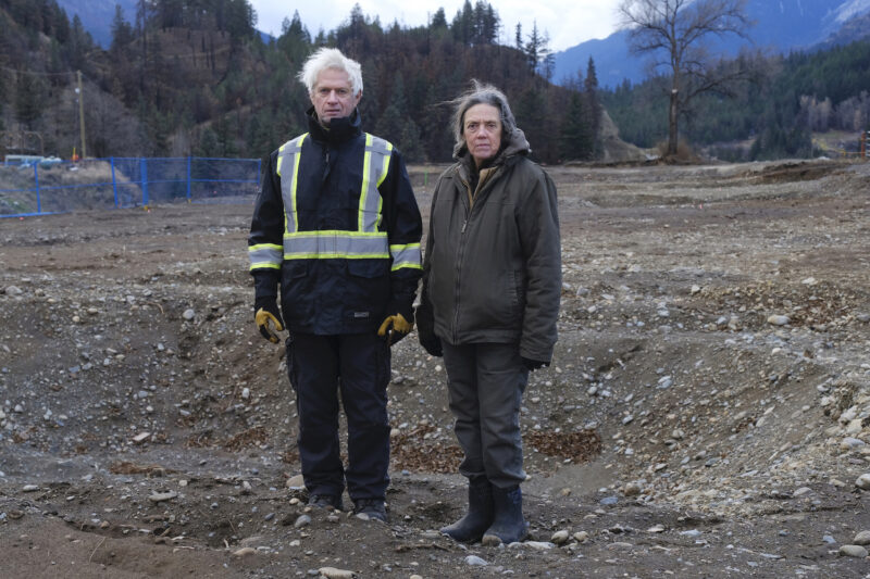 Owen and Patsy stand in front of their property.
