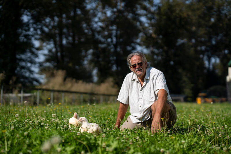 Portrait of Cory Spitters with his chickens